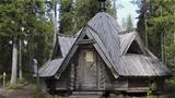 A traditional log-built Lapp hut sits at the edge of Sortovaara Hill. Photo: AT